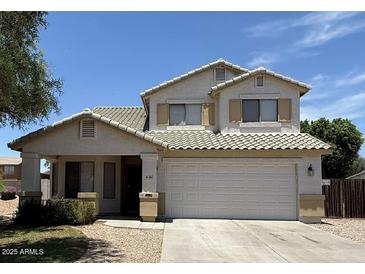 Charming two-story home with a well-maintained front yard and tile roof at 16784 W Polk St, Goodyear, AZ 85338