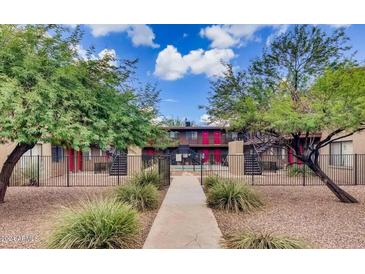 Charming apartment complex featuring well-maintained landscaping and inviting walkways at 310 W Earll Dr # 102, Phoenix, AZ 85013