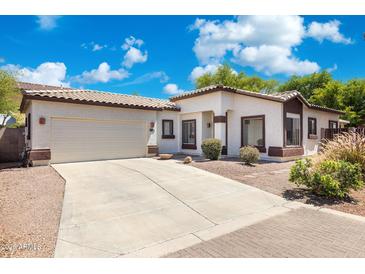 Charming single-story home with a two-car garage and well-maintained front yard landscaping at 6425 S Kimberlee Way, Chandler, AZ 85249