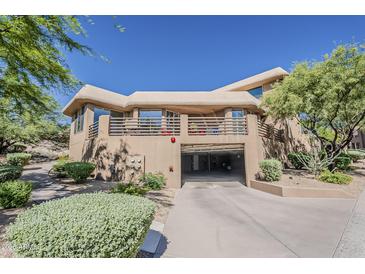 Stunning Southwestern-style home with a balcony and covered parking at 10222 E Southwind Ln # 1018, Scottsdale, AZ 85262