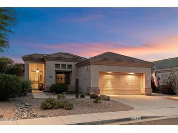 Charming single-story home with desert landscaping and a two-car garage at 22432 N 52Nd Pl, Phoenix, AZ 85054