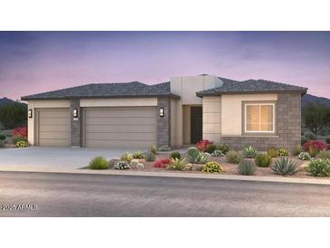Stylish single-story home featuring a neutral color palette, desert landscaping, and a spacious two-car garage at 24726 N 169Th Ave, Surprise, AZ 85387