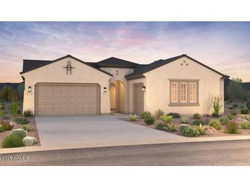 Beautiful single-story home with a neutral color scheme, manicured landscaping, and a two-car garage at 24819 N 169Th Dr, Surprise, AZ 85387