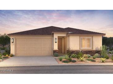 Charming single-story home featuring a two-car garage, neutral stucco, desert landscaping, and a brown shingle roof at 25340 N 172Nd Dr, Surprise, AZ 85387