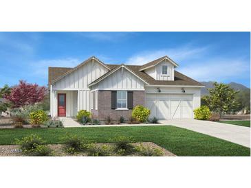 Charming single-Gathering home with white siding, brick accents, manicured lawn and a two car garage at 3604 W Horse Trail Way, San Tan Valley, AZ 85144