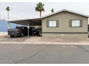Inviting mobile home with covered parking, desert landscaping and a paved drive way in a well maintained community at 8218 S 7Th St # Ofc, Phoenix, AZ 85042