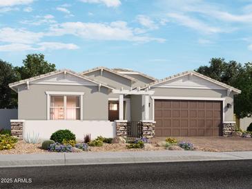 Charming single-story home with a two-car garage, desert landscaping, and neutral color palette at 17646 W Mariposa Dr, Goodyear, AZ 85395