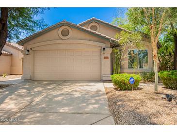 Charming single-story home featuring a two-car garage and low maintenance landscaping at 20044 N 30Th Pl, Phoenix, AZ 85050