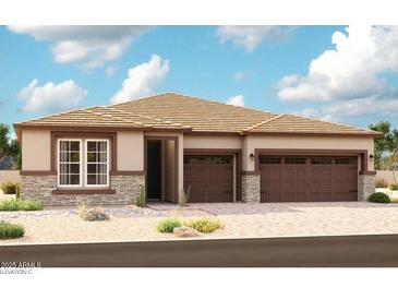Charming single-story home featuring stone accents, a tile roof, and a two-car garage at 20188 W Monterey Way, Buckeye, AZ 85396