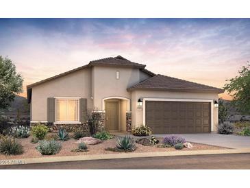 Charming single-story home with a well-manicured front yard and a two-car garage, perfect for suburban living at 6338 W Rushmore Way, Florence, AZ 85132