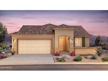 Charming single-story home with a desert landscape, two car garage, and a tile roof at 7661 W Meadowlark Way, Florence, AZ 85132