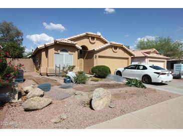Charming single-Gathering home with desert landscaping and a two-car garage at 16251 N 91St Dr, Peoria, AZ 85382
