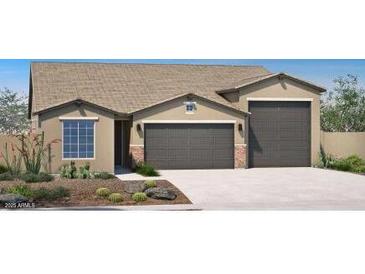 Charming single-story home featuring a 2-car and a single-car garage and low maintenance desert landscaping at 4933 W Capistrano Ave, Laveen, AZ 85339