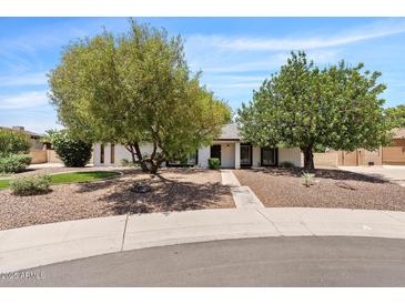 Charming single-story home with mature shade trees and well-maintained landscaping in a desirable neighborhood at 5912 E Wethersfield Rd, Scottsdale, AZ 85254