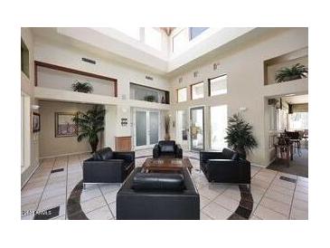 The spacious lobby area is brightly lit with comfortable seating and stylish decor at 11375 E Sahuaro Dr # 2064, Scottsdale, AZ 85259