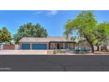 Charming single-story home featuring a three-car garage, mature trees, and a well-maintained front yard at 238 W Myrna Ln, Tempe, AZ 85284