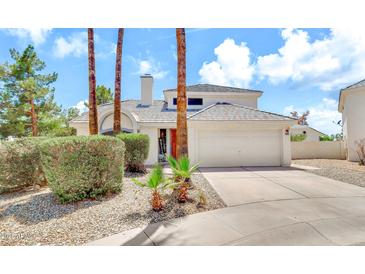 Charming home featuring manicured landscaping, a two-car garage, and a welcoming front entrance at 3389 W Barcelona Dr, Chandler, AZ 85226