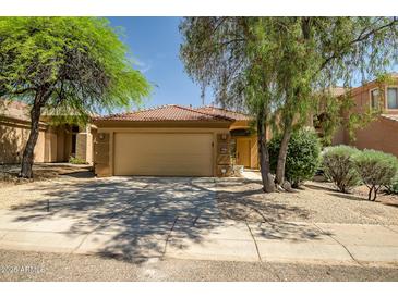 Charming single-story home with a well-maintained front yard and a two-car garage at 5125 E Juana Ct, Cave Creek, AZ 85331