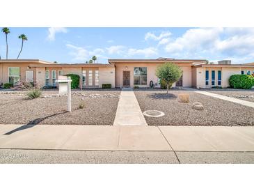 Inviting single-story home featuring a well-kept front yard and desert landscaping at 13428 N Hawthorn Dr, Sun City, AZ 85351