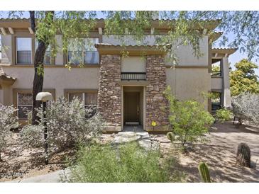 Charming home featuring a stone pillar entrance and well-maintained desert landscaping at 19700 N 76Th St # 1103, Scottsdale, AZ 85255