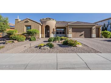 Charming single-story home with a well-manicured yard and a two-car garage at 3925 E Elmwood St, Mesa, AZ 85205