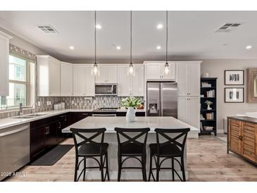 Stylish kitchen features a large island with seating and stainless steel appliances at 820 N 8Th Ave # 14, Phoenix, AZ 85007