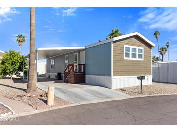 Charming single-story home with covered parking and low-maintenance desert landscaping at 701 S Dobson Rd # 447, Mesa, AZ 85202