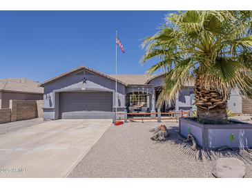 Charming single-story home featuring a well-maintained front yard and two-car garage at 6154 S Borego Rd, Gold Canyon, AZ 85118