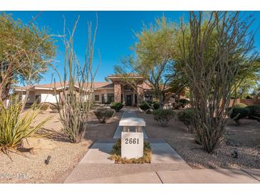 Inviting home exterior featuring desert landscaping and a stone-accented entrance at 2661 E Birchwood Pl, Chandler, AZ 85249