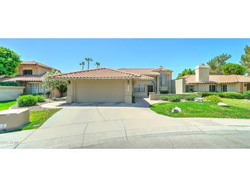 Charming single-Gathering home with a well-manicured lawn and desert landscaping in a desirable neighborhood at 5431 E Piping Rock Rd, Scottsdale, AZ 85254
