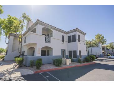 Exterior of multi-Gathering home with light stucco, tile roof, and covered patio at 600 W Grove Pkwy # 2188, Tempe, AZ 85283