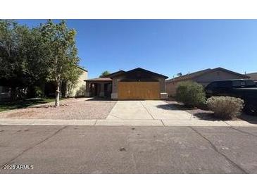 Charming single-story home with low maintenance landscaping and a private two-car garage at 990 E Desert Rose Trl, San Tan Valley, AZ 85143