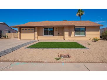 Charming single-story home with a well-manicured front yard and desert landscaping at 1430 N Ashland --, Mesa, AZ 85203