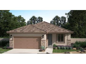 Charming single-story home featuring a two-car garage, neutral paint, and well-manicured front yard at 17032 W Cavedale Dr, Surprise, AZ 85387