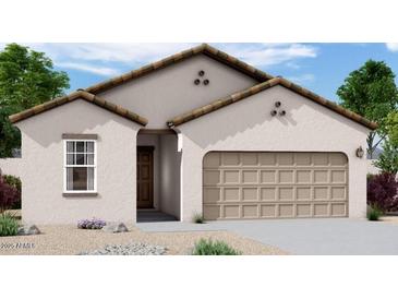 Charming single-story home with a two-car garage and low maintenance desert landscaping at 6022 E Artemis Dr, Florence, AZ 85132