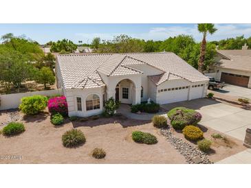 Aerial view of home with manicured front yard and 3-car garage at 804 N 46Th St, Mesa, AZ 85205