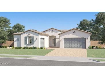 A charming single-Gathering home with a well-manicured lawn and a neutral-colored facade at 9621 W Monterey Way, Phoenix, AZ 85037