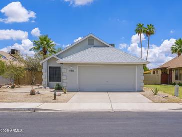 Charming single-story home with a well-maintained front yard and a two-car garage in a desirable neighborhood at 10613 S 41St Pl, Phoenix, AZ 85044