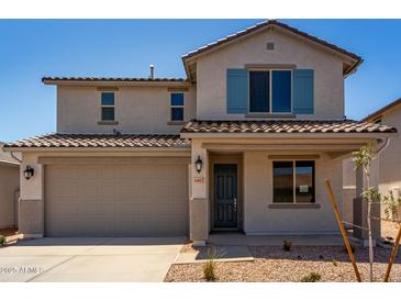 Charming two-story home featuring a tile roof, neutral stucco, and desert landscaping at 31822 N Bandit Rd, San Tan Valley, AZ 85143