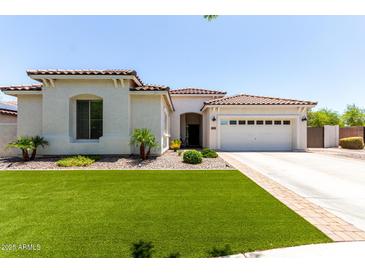 Charming single-story home with well-maintained lawn and desert landscaping at 6317 S Banning St, Gilbert, AZ 85298