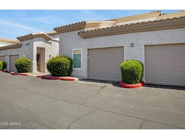Charming condo featuring a two-car garage and well-maintained landscaping at 3236 E Chandler Blvd # 2018, Phoenix, AZ 85048