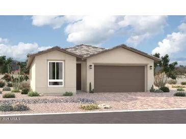 Charming single-story home featuring a two-car garage and desert landscaping at 15808 W Vogel Ave, Goodyear, AZ 85338