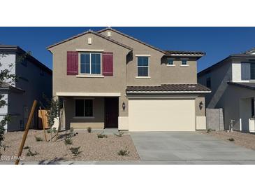 Inviting two-story home with a spacious two-car garage and low maintenance landscaping at 22863 N 183Rd Dr, Surprise, AZ 85387