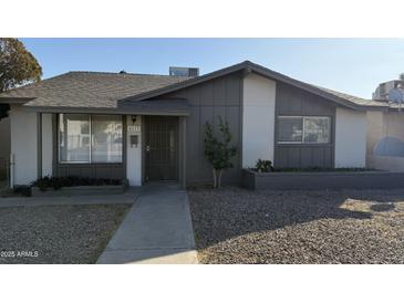 Charming single-story home with a well-maintained gravel yard and neutral exterior paint at 4217 W Medlock Dr, Phoenix, AZ 85019