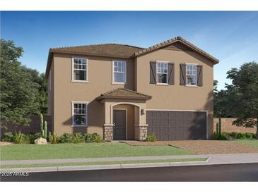 Charming two-story home with a two-car garage, a covered porch, and desert landscaping at 9541 W Pinchot Ave, Phoenix, AZ 85037