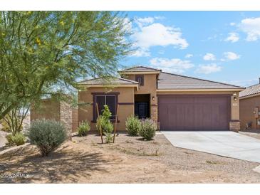 Charming single-story home with desert landscaping and a spacious two-car garage at 18333 N Presley Ln, Maricopa, AZ 85138