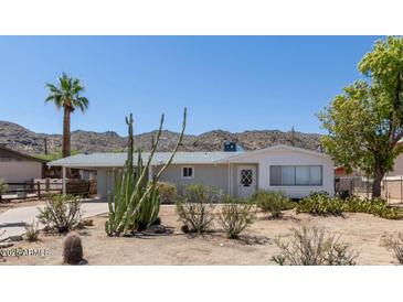 Charming single-story home featuring desert landscaping and a covered carport at 1413 E Dobbins Rd, Phoenix, AZ 85042