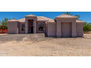 Stunning one story home boasting a well-maintained landscape, desert surroundings and tile roof at 19621 W Minnezona Ave, Litchfield Park, AZ 85340