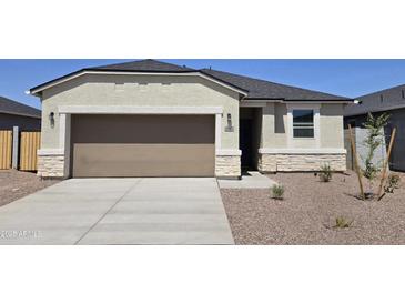 Charming single-story home showcasing a well-manicured yard and neutral color palette at 35512 N Common Ct, San Tan Valley, AZ 85140