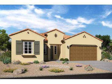 Charming single-story home with a tile roof, two-car garage, and desert landscaping in a sunny setting at 6190 N Sunrise Ln, Buckeye, AZ 85396